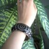 Elegant Black and Metal Combo Bracelet With Unique Flowers Design