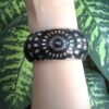 Elegant Black and Metal Combo Bracelet With Unique Flowers Design