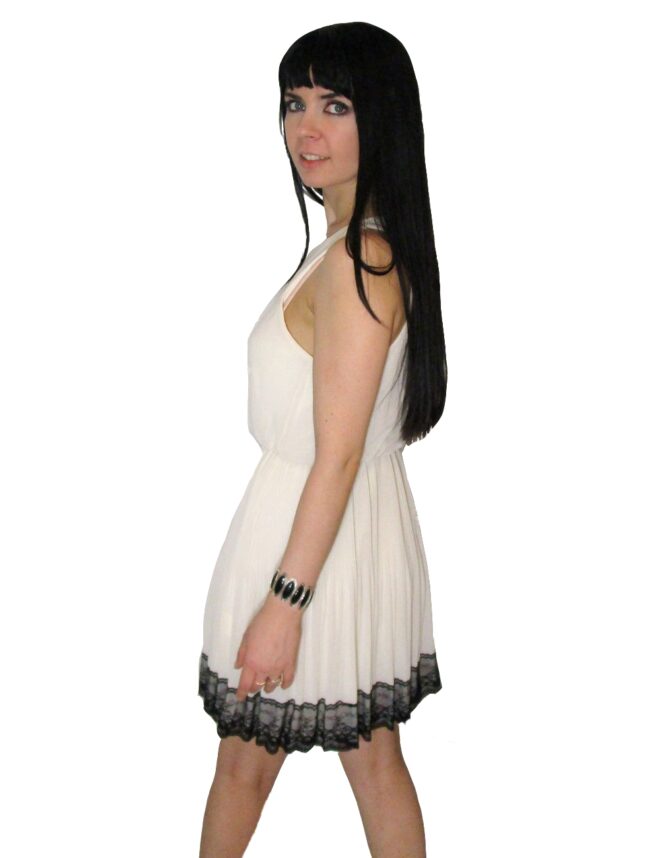 Beige Mini Dress With Flared Skirt And Black Lace Trim at The Bottom Of The Skirt